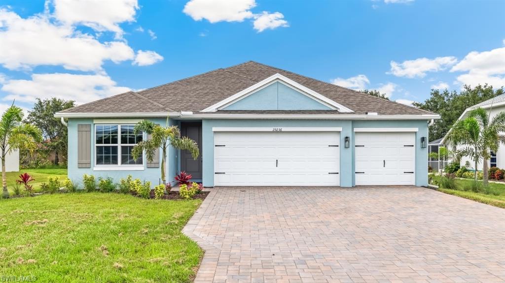 One or more photo(s) has been virtually staged, AI generated or rendered.  The Madison floorplan in Lehigh Acres is a 2,020 square foot home with four bedrooms, three bathrooms, with a three-car garage. Entering the home, a long foyer divides the home into two sides with bedrooms on each end. Two bedrooms share a bathroom on one side with another bedroom, bathroom, and the laundry room on the opposite side. 

At the of the foyer, the home showcases the expansive open-concept floorplan including the kitchen, living room, and dining room. The living room overlooks a covered patio, perfect for outside dining or entertaining in the beautiful Florida weather. 

The spacious primary suite is nestled away with an en suite bathroom. The bathroom is appointed with a dual sink vanity, ceramic tile walls in the shower, large walk in closet, and a second closet for linens or additional clothing items. 

The three-car garage is a spectacular feature that can be used for additional storage, workbench or tools, exercise space, or the traditional use for a third car. 

Discover how easily the Madison floorplan can fit your lifestyle and schedule an appointment today.