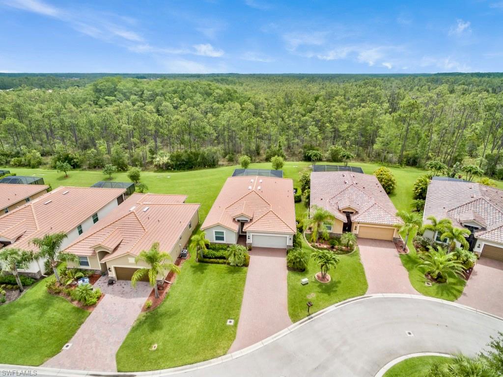 Exquisite single-family home tucked away in a quiet cul-de-sac! Relax in your private pool while enjoying expansive nature preserve views. This move-in ready home features 4 bedrooms, 3 baths, immaculately kept with a homesite you'll want to call your own.  Over 2000 quality square feet offering neutral colors throughout, crown molding, extensive tile flooring, granite countertops throughout, beautiful kitchen overlooking the great room area, leaded glass door entry, newer carpet in the bedrooms, upgraded fans/light fixtures and much more! Bella Terra has a Resort-style Clubhouse, 24 hour fitness center, activities for all ages, resort pool and spa, children's play area, tennis courts, pickle ball, walking trails and much more....and the best part is the LOW HOA fees you get in beautiful Bella Terra!