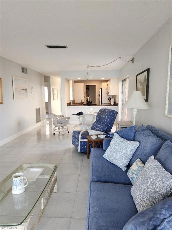 Direct Gulf Access END UNIT 1st Floor Condo in the waterfront community of Gullwing Condo. Panoramic views overlooking wide 200+ Foot Canals and Boats going by from the neighboring communities and homes. Instant Boating Access with NO BRIDGES one turn to open water - minutes. You can even see the River from the community dock. Remodeled throughout with 2-bedroom 2-bathroom 1,034 SF and personal carport in front of the unit. Kitchen remodeled with granite counters, stainless steel appliances, and new white cabinets with stylish black hardware. Tile floors in the living areas and wood-like floors in the bedrooms NO CARPET! Amazing views from the open living room with wall-to-wall sliding glass doors overlooking the expansive water views, docks, and boats. TWO PATIOS small patio on the side by the kitchen and dining, and a large screened in patio on the water. Lots of natural light only found in a ground floor corner unit. Wake up each morning to water views and boats leaving to go out fishing - waterfront master suite with remodeled bath with barn door, walk-in closet, new vanity and walk0in shower. Spare bedroom is good size for guests, bedroom, or home office. Spare full bathroom also completely remodeled. MOVE IN READY! The Community Pool is Waterfront, Heated and offers a Clubhouse with an Equipped Kitchen for your convenience. Walking distance to Jaycee Park, Restaurants & Shopping are all close by! NEW Boat Slips will be done soon and will offer boating access upon completion. You WILL Experience Florida's Beautiful Wildlife Firsthand. Dolphins, Manatee and variety of Birds. Located close to shopping, dining, events, Starbucks, Dunkin Donuts, Target, Publix, and the area’s top-rated restaurants. GOLFERS - Very close to Palmetto Pines Country Club and Coral Oaks. Close to shopping, beaches, dining, easy access to Fort Myers via both bridges, and near many of Cape Coral's newest development and community projects like the Yacht Club, Bimini Square, The Cove, and Slipaway for even more fun things to enjoy!