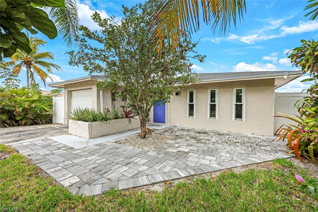 Thoughtfully updated with an effortless coastal living! This 3/2 residence offers the beach lifestyle of your dreams in this prime location blocks to the white sugar sand! The light-filled interior showcases an open kitchen with crisp white cabinetry, quartz countertops, stainless steel appliances, and a glass mosaic backsplash, complemented by updated flooring. The French door leads directly to your barbecue area right outside of the kitchen! Curated lighting and fixtures, and fresh interior including trendy white exterior paint! Both bathrooms have been nicely updated and refreshed, and the primary suite features a customized walk-in closet. The home opens to a private, tropical-style setting complete with a spa designed for relaxation and entertaining, featuring mature fruit trees. Newer 6ft privacy fence provides privacy that creates a tranquil retreat and the 2019 roof adds peace of mind! Just minutes from white-sand beaches, Mercato, Whole Foods, The Ritz, The Pavilion shopping with La Fitness and movie theatre plus plethora of casual and fine dining and shopping! Move right into this turnkey residence which captures the essence of coastal living! Flood Zone X.