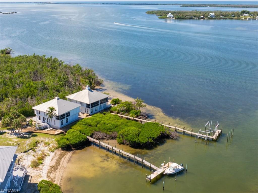 Tucked away in a quiet, seldom-traveled enclave along the mid-western shoreline of Useppa Island, this private 
2-bedroom, 2.5 bath attached villa offers a rare sense of seclusion paired with sweeping coastal views. Oriented to the northwest, the residence overlooks the Intracoastal Waterway with panoramic sightlines stretching across Cabbage Key, Cayo Costa, Boca Grande Pass, and Gasparilla Island beyond.
The home features a thoughtfully designed “upside-down” floor plan, with two en-suite bedrooms located on the first level and the main living areas positioned above to fully capture the stunning water views. Upstairs, the kitchen, living room, and screened waterfront balcony create an inviting space for daily living and entertaining, while the lower-level bedrooms provide a quiet retreat at day’s end.
Designed for comfort and peace of mind, the villa is equipped with impact-rated windows and doors, along with electric storm panels protecting the screened balcony. Tasteful updates are found throughout, including recently renovated bathrooms, a new HVAC system, and a new water heater. Timeless wood flooring runs through the bedrooms, where classic finishes are complemented by the warmth and character of a traditional fireplace.
Just beyond the living room, the screened balcony overlooks a protected basin and shared dock. The property includes a one-third ownership interest in the dock, granting use of a boat slip—an exceptional amenity for island living. The dock sits just off the Intracoastal Waterway, with Cabbage Key less than a half-mile to the south. Cayo Costa State Park, renowned for its 7.5 miles of pristine Gulf beaches, is a short boat ride away via either Captiva Pass or Boca Grande Pass, both within four miles.
For many buyers seeking a true Florida island escape, sunset water views and private, deeded dockage rank at the top of the wish list. This residence offers both—providing a rare blend of convenience, beauty, and long-term investment security. Unit #303-A delivers these highly sought-after features in a thoughtfully finished, low-maintenance package.