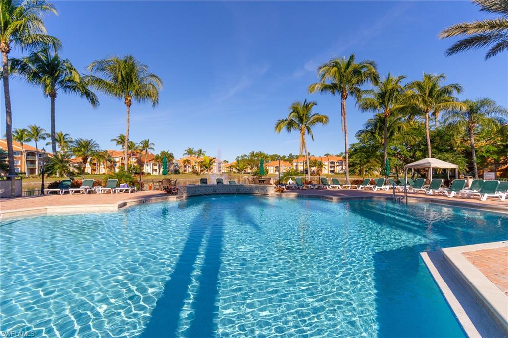 Your Perfect Piece of Paradise at the Perfect Price!  This turnkey, two bedroom,one bath, first floor, end unit is conveniently located across the way from the pool. The kitchen has brand new quartz countertops and stocked with everything you need to move right in. The Enclave of Naples is a gated community with beautiful amenities including community pool, spa, bar, club house, library, fitness center, racquet ball, billiards, tennis courts and outdoor grilling area. The community has just been painted and roofs replaced.  Minutes to Down Town Naples with wonderful restaurants, shopping and Beaches make this unit a great location.  This is a great home, vacation destination or investment opportunity.