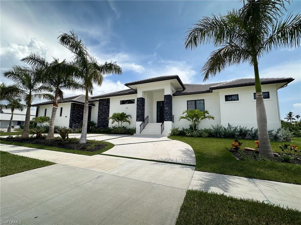 *New Build Currently under construction* 
This beautiful tropical property with Hawaiian flare includes a luxurious private casita separate from the home that overlooks a sparkling pool and spa, creating a perfect oasis for relaxation and entertainment. The residence offers a seamless blend of indoor and outdoor living with spacious interiors, modern amenities which is ideal for those seeking a refined and tranquil lifestyle.