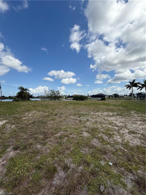 Exceptional lakefront commercial site with a newly constructed seawall and desirable P1-W zoning. This unique property offers a rare opportunity to develop a professional office building in a highly visible and growing area of Cape Coral. Enjoy beautiful water views that create an attractive setting for clients, customers, and employees alike. Conveniently located near shopping, dining, and major roadways, this site combines functionality, accessibility, and aesthetic appeal. Design assistance needed...just ask! Opportunities like this are becoming increasingly difficult to find.