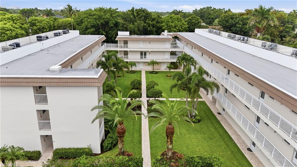 One or more photo(s) has been virtually staged, AI generated or rendered.  Welcome to Riviera at the Moorings, a charming 55+ lakefront community ideally located west of U.S. 41 in the heart of Naples. This bright and inviting first-floor corner residence offers 2 bedrooms, 2 bathrooms, and an abundance of natural light thanks to its desirable end-unit location. Enjoy a spacious great room, tile flooring throughout, generously sized bedrooms, and a large screened lanai overlooking a private landscaped setting. Adding to the home’s convenience, your assigned parking space is located just steps from the screened lanai, providing easy access for groceries, beach gear, and everyday living.

Residents enjoy a lakefront pool, community dock, social gathering spaces, and easy access to Naples’ most sought-after destinations. Just minutes from the beach, Venetian Village, Waterside Shops, and downtown Naples, this home delivers the perfect blend of convenience, comfort, and coastal lifestyle. Owners may also be eligible for membership to the private Moorings Beach Park, offering exclusive access to one of Naples’ most beautiful stretches of Gulf shoreline.

Whether you’re seeking a seasonal retreat or year-round residence, this exceptional home offers the best of Naples living in an unbeatable location.