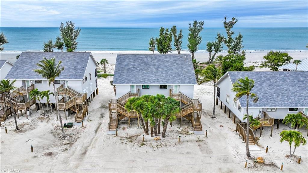 Welcome to 1403 Beach Cottage!  A coastal inspired and completely renovated, turnkey 2 bedroom / 2 bath condominium with breathtaking beach views and stunning sunsets.   Embrace the extraordinary at Beach Cottages located inside the reimaged South Seas Resort.  The association has recently completed a transformation of the common areas including resurfacing of the pool and new patio furniture, expansion of the pool deck and addition of lush tropical landscaping, new roofs, installation of exterior Hardie siding, replacement of all staircases and railings,  updating the tennis court and adding pickle ball, and all new lanais.  You'll love the improvements to the interior including the 2 new bathrooms, smartly designed custom kitchen with quartz countertops and GE Profile appliances, functional laundry room with an owner's closet, new hot water heater, current plumbing system, wind resistant impact windows and bi-fold sliding glass doors, cozy plantation shutters, LED recessed lighting, outside shower and an underneath the building storage shed complete with shelving, a full sized refrigerator w/ icemaker, beach chairs, umbrella, rafts and toys. The condo has gorgeous beach and sunset views from the screened lanai which allow for use to sit and take in the beautiful views of the Gulf as well as a ground level private paver patio which has an outdoor shower and foot wash station.  The condo is a short walk to the Village of Captiva with themed restaurants and cute shops.  Excellent rental income history.  Unlimited owner usage in South Seas rental management program.  Life is Better at the Beach!  Please call for your private showing.