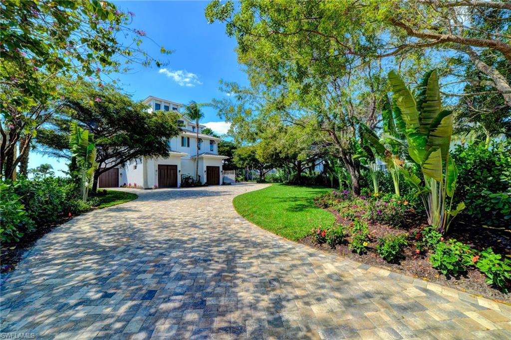 Perhaps Barefoot Beach's most private and luxurious direct gulf front estate. Stunning property is truly like no other in the community. Sprawling 2017 custom luxury home has just been completed on this expansive double lot that offers Barefoot's largest and finest landscaped driveway and front yard. This incredible home offers all the cosmopolitan coastal living, but also offers a special level of privacy and sprawl that makes this a truly rare opportunity and not one to be missed!  Original concrete pilings & structure used, everything else is new!  Breathtaking views of the beautiful Gulf of Mexico are found from nearly every room.  Quality craftsmanship and details are among a few of the luxurious appointments found throughout. Interior amenities include, striking quartzite countertops in the kitchen, beautiful wide plank wood flooring throughout, marble baths, custom solid wood cabinets, custom ceiling details, private elevator, and many more upgrades. No detail has been overlooked-this is truly an exceptional Barefoot Beach home!