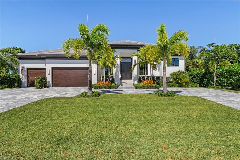 Introducing 625 Parkview Lane - paradise located in the heart of Park Shore. This 3 bed + study, 3.5 bath home completed in 2019 by luxury builder, Borelli Construction of Naples, offers all the amenities for relaxing, entertaining and simply enjoying the Naples lifestyle. The home is situated on a quiet street within close proximity to the private Park Shore beach. The exterior features clean lines and all impact windows and doors while the inside is warm and inviting. Legno Bastone French white oak floors, tall ceilings with unique details and attractive trim work throughout. The spacious kitchen has high-end appliances, Taj Mahal quartzite countertops, oversized island with space for seating and custom European cabinetry with the pantry conveniently tucked in the corner. The great room has a custom built-in to enclose the TV and a wet bar with wine fridge. The owner's suite boasts a sun-filled bathroom with dual sinks and makeup vanity, separate closets with custom built-ins and convenient access to the spa. The outdoor living space features distinct areas for enjoying the weather, a full outdoor kitchen and retractable screens.
