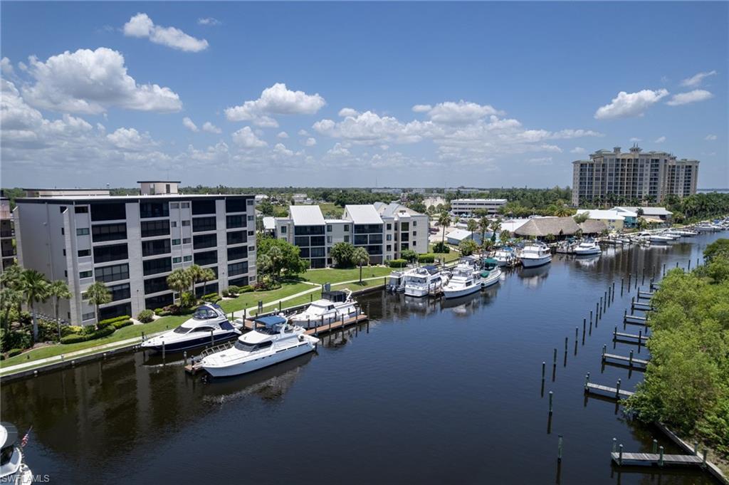 Stunning first floor condo with breathtaking water views and southern exposure, offering spectacular sunsets year round. This beautifully renovated residence features an open concept design with a sleek kitchen complete with a breakfast bar, flowing seamlessly into the dining area and out to a private lanai where you can soak in the scenery. The spacious master suite includes a generous walk in closet , master bath with dual sinks and a walk in shower. In residence laundry adds everyday convenience. Offered turnkey! Brand new appliances, HVAC system and hot heater.
Community amenities elevate the lifestyle here: a riverside pool, two BBQ areas, a library, and a community room for gatherings. With several restaurants and shops just a short stroll away, everything you need is right at your doorstep.