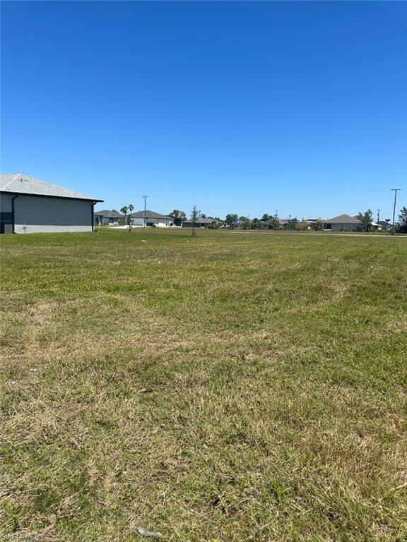 Welcome to your dream residential lot. This large 80' wide by 125' deep lot is the perfect blank canvas to build your dream home. With city water and sewer already connected, this lot is ready for you to start planning your dream home.

This is the best priced buildable lot in the area, surrounded by newly built homes and even more homes that are under construction in the area. You'll be surrounded by a beautiful neighborhood with a community feel.

Location is key and this lot is conveniently located just a short walk away from Jim Jeffers Park and Christa McAuliffe Elementary School, or a three-minute drive by car. You'll also be within walking distance of Publix, Walgreens, and restaurants, making errands and dining out a breeze.

This lot is close to Pine Island Rd, providing easy access to excellent fishing in Bokeelia and Matlacha. You'll be able to enjoy all the best of Florida living right from your own backyard.

Don't miss your chance to own this amazing residential lot in Cape Coral. Start living your Florida dream today!