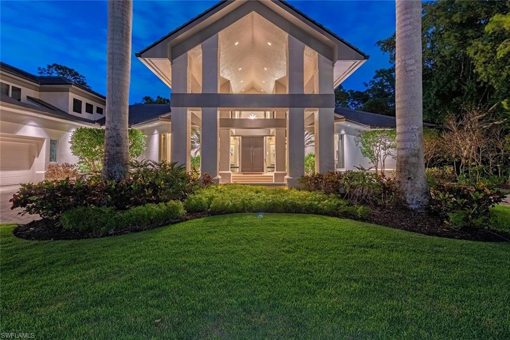 Welcome to Resort Style Living, Welcome to Grey Oaks! Walk to the Club from this  exceptional estate with golf cart included. Also offering the rare opportunity to obtain a FULL GOLF MEMBERSHIP with purchase. This spectacular Grey Oaks residence has been completely transformed into a refined coastal contemporary retreat, showcasing exquisite finishes, sophisticated design elements, and a luxurious and welcoming ambiance throughout. Thoughtfully curated with exceptional attention to detail, the home blends timeless elegance with modern comfort, creating a true showcase property in one of Naples’ most prestigious communities.

Beautiful solid-surface finishes, designer lighting, custom details, and rich textures define the interiors, while the stunning modern kitchen serves as the centerpiece of the home with its sleek cabinetry, premium appliances, and stylish gathering spaces designed for both everyday living and entertaining. Updated baths offer a spa-inspired experience with elegant materials and high-end fixtures, while new carpeting and fresh designer touches throughout complete the home’s polished aesthetic.

Perfectly positioned on a private homesite overlooking the Pine Course’s 5th fairway, the residence embraces Naples’ signature indoor-outdoor lifestyle with dramatic volume ceilings, expansive windows, and walls of sliding glass doors that flood the home with natural light. Outdoor living is nothing short of exceptional, featuring a  constructed beam-and-column panoramic screen enclosure surrounding the resort-style pool and cascading waterfall, expansive sun deck, lushly enhanced landscaping, tranquil garden spaces, and a fully equipped summer kitchen with gas grill—creating the perfect setting for elegant entertaining or private relaxation.

Additional enhancements include a recently updated roof with foam insulation, newer HVAC systems, a LeafGuard gutter system, tankless water heater, and whole-home generator for added comfort and peace of mind. The home also features an impressive temperature-controlled wine cellar accommodating approximately 850 bottles, a private study with custom built-ins, hidden air-conditioned second-floor storage, and an air-conditioned three-car garage with epoxy flooring, custom cabinetry, utility sink, and professional studio lighting.

Located just moments from Naples’ world-class beaches, fine dining, and luxury shopping, this extraordinary residence offers an exceptional opportunity to enjoy the sophisticated Grey Oaks lifestyle at its finest.
 Grey Oaks Country Club is Naples one and only private club with 54 holes of golf. In addition, the club offers exclusive amenities for all, from the newly renovated wellness center to the lagoon style pool, tennis, pickle ball, bocce, restaurants, spa... the amenities are endless.