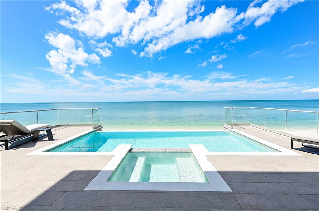Fantastic Bonita Beach home! Just when you thought you may have missed your Beach Home, the best single lot Bonita Beach house is now available. This DCS custom built home is amazing and offers features above and beyond the typical spec home. The main living level includes two private guest suites w/ full baths, guest laundry, custom bar w/ seating and custom glass enclosed wine wall, and a gourmet kitchen that includes Thermador appliances, breakfast bar & stunning custom cabinetry. The great room offers intricate ceiling detail & panoramic Gulf views. An elevated, negative edge pool & spa can be found off of the main living level with glass railings to maximize Gulf views, outdoor kitchen, and convenient pool bath. The 3rd floor features the master bedroom, bonus/entertaining room, guest suite, and study/home office. The master bedroom includes a private lanai, fireplace and a spacious bathroom w/ Toto toilet, walk-in shower w/ seamless glass door & multiple shower heads. The bonus room features custom bar, gorgeous wood beamed ceilings, & lanai overlooking the Gulf of Mexico. And the designer furnishings package are included in the price!  Close and move in for spring break.