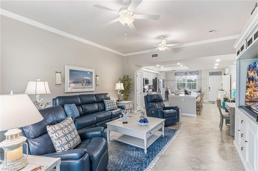 Experience the very best of resort-style living in the prestigious Palazzo enclave of Pelican Preserve. Beautifully decorated and sold turnkey furnished, this exceptional fourth-floor residence offers a rare combination of sophisticated design, effortless convenience, and an award-winning lifestyle.

One of only a select few residences featuring the highly desirable open-concept floor plan, this two-bedroom, two-bath home is beautifully appointed and shows like a model. Designed for both comfortable everyday living and effortless entertaining, the residence showcases crown molding throughout, elegant 20-inch tile flooring in the main living areas, plantation shutters throughout, custom draperies, designer lighting, and carefully selected furnishings that create a sophisticated yet inviting atmosphere.

The stunning kitchen is the heart of the home, featuring white 42-inch cabinetry, quartz countertops, stainless steel appliances, and a large center island perfect for gathering with family and friends. Every detail has been thoughtfully selected to combine style, function, and timeless appeal.

Step onto the spacious screened lanai and enjoy beautiful preserve views that provide a peaceful and private backdrop for relaxing or entertaining. A hurricane-rated Kevlar screen adds both protection and convenience, eliminating the need to bring outdoor furniture inside during storm season. Whether enjoying your morning coffee, watching local wildlife, or unwinding at sunset, this outdoor living space is designed to be enjoyed year-round.

Additional features include impact-resistant windows and doors, covered parking, a private storage room, and electrical service conveniently available at the building for golf cart charging. Palazzo residents enjoy exclusive access to a private pool, spa, and social gathering area, creating an intimate neighborhood atmosphere within the larger Pelican Preserve community.

Beyond your doorstep awaits a lifestyle unlike any other. Pelican Preserve offers an extraordinary collection of amenities, including 27 holes of championship golf with no mandatory membership, pickleball, tennis, bocce, fitness and wellness facilities, arts and crafts studios, a theater, multiple dining venues, nature preserves, walking trails, and an endless calendar of social activities. Whether your passion is recreation, wellness, creativity, or simply spending time with friends and neighbors, every day presents new opportunities to enjoy the lifestyle you've earned.

Beautifully furnished, impeccably maintained, and ideally positioned to capture tranquil preserve views, this move-in-ready residence offers the perfect opportunity to start enjoying the Pelican Preserve lifestyle from day one.

Don't miss this exceptional opportunity to own one of Palazzo's most desirable homes—schedule your private showing today.