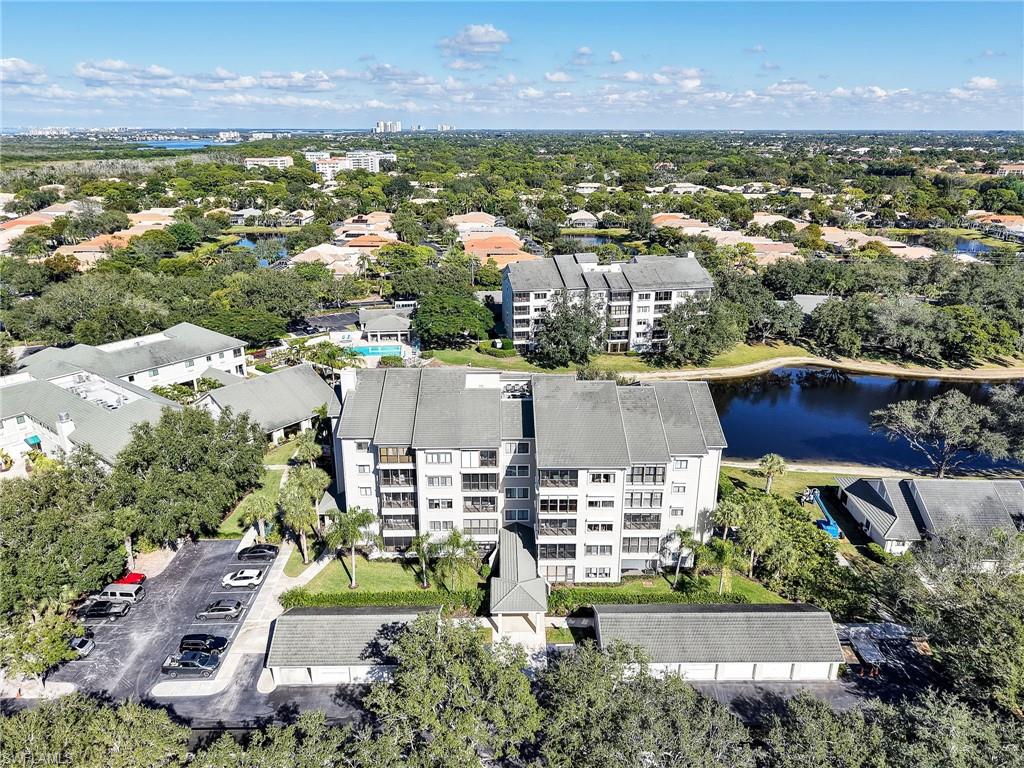 One or more photo(s) has been virtually staged, AI generated or rendered.  Enjoy a vibrant, maintenance-free lifestyle in the highly sought-after Arbor Trace community, one of North Naples’ leading active adult destinations. This charming 1-bedroom, 1-bath residence offers a warm and comfortable layout designed for easy everyday living. The spacious enclosed lanai seamlessly extends the interior living area, creating the perfect space to relax with your morning coffee, entertain guests, or simply unwind while taking in the peaceful surroundings. Arbor Trace is a premier 55+ community offering deeded condominium ownership with 100% equity and no financial or medical requirements. Residents enjoy a maintenance-free lifestyle with all utilities included in your monthly condo fee: water, electric (excluding tower), sewer, trash removal, recycling, pest control, and cable TV/Wi-Fi for all individual units. The monthly club fee includes amenities such as a resort-style heated pool, fitness center, tennis/pickleball courts, bocce courts, a golf putting green, two libraries, curated social events, and a meal plan. Benefit from comprehensive support services such as 24-hour medical monitoring, transportation to medical appointments, shopping, and group outings. Enjoy peace of mind with on-site assisted living if you need it.
