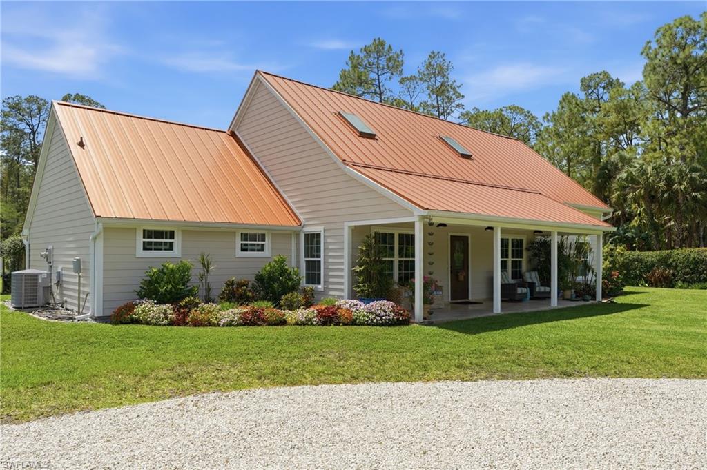 This exceptional farmhouse-style 3BR/3BA estate sits on 2.73 acres of cleared, high-and-dry land in Golden Gate Estates with no wetlands, Flood Zone X, and no HOA. Offering 2,288 square feet of thoughtfully designed living space, the property features beautifully manicured grounds, a tranquil koi pond, a sparkling pool, and the privacy and space you've been searching for.

Move-in ready and impeccably maintained, this one-of-a-kind property combines modern farmhouse charm with the freedom of country living—without sacrificing convenience.  If you're looking for room to breathe, space for your toys, and a home that's as beautiful outside as it is inside, this is one you won't want to miss.