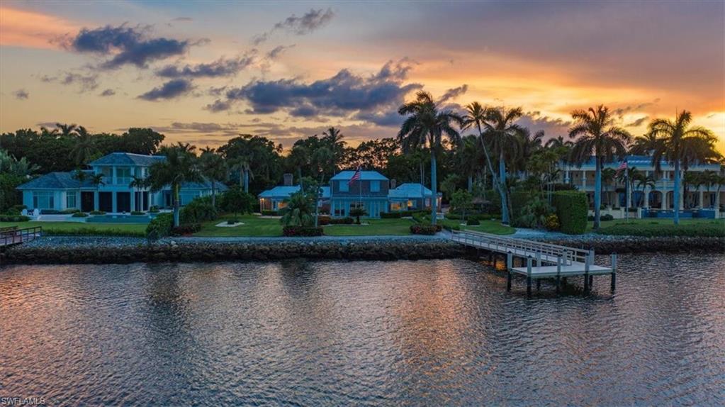 Enjoy breathtaking panoramic water views from one of the most desirable Port Royal properties available in 40 years! With a lot-and-a-half at .89 Acres, this private and serene estate encompasses nearly an acre of waterfront property with 151’ of deep water-frontage on Naples Bay.  Property is a boaters dream with direct access to the Gulf of Mexico just minutes away. Resplendent lanai views showcase picturesque mangroves framed by the expansive water of Naples Bay. Discover luxurious living in Port Royal, one of the most beautiful and verdant communities in Southwest Florida.  The current residence has been meticulously maintained and consist of four bedrooms plus den with a separate study/office and is ready for your finishing touches while you design and build your dream home.  You will marvel at the quiet serenity offered by this lovely Galleon Drive site ideally located a short bike ride from the beach and is just minutes from 3rd Street South, and 5th Avenue South’s fine dining, world-class shopping, and entertainment. Port Royal Club membership eligibility.