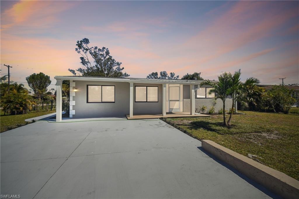 Welcome to 6659 Fiesta Way, a tastefully remodeled 3/2 home on a 10,149 sq ft, fenced in, corner lot. The property boasts brand new flooring, new high impact resistant windows, a brand-new shingle and flat roof, newly remodeled bathrooms with brand-new stainless-steel fixtures, all-new HVAC system, air ducts and lines, new stainless-steel appliances, a brand-new utility room with washer and dryer and tankless water heater and brand-new lighting fixtures throughout. All electrical switches and outlets have been upgraded as well as a new electrical panel installed. The home is in immaculate condition. No flood or water damage from hurricane Ian, all inspections welcome. The home is located within walking distance to Cypress Lake Middle School and High School and a short distance from Ruttenberg Park, Myerlee Country Club and Cypress Country Club. Cape Coral Bridge is just a short drive away and you are so close to the beaches, you may even smell the salt water! Bring your pickiest clients, this home will not last. It is priced to sell. All financing types welcome. A 3D virtual tour is available on the MLS listing. NO HOA, LOW TAXES; The perfect gateway into homeownership! Seller motivated, bring all offers!