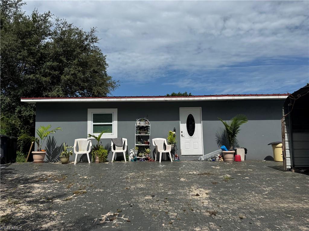 Welcome to this beautifully renovated 3-bedroom, 2-bath home situated on a spacious corner lot in the heart of Okeechobee! This move-in ready property features modern updates throughout, offering a bright and comfortable living space perfect for families, first-time buyers, or seasonal residents. Enjoy the convenience of a large covered carport with ample parking and a detached storage building that also serves as a functional laundry room, providing extra storage and versatility. The generous lot offers plenty of room to add a pool, park a boat or RV, or create your own outdoor oasis. Located in one of Florida's most desirable outdoor recreation areas, Okeechobee is known for world-class fishing and boating on the famous Lake Okeechobee, one of the largest freshwater lakes in the United States. Residents enjoy a relaxed lifestyle with easy access to parks, golf courses, shopping, restaurants, schools, and year-round outdoor activities, while still being within a reasonable drive of Florida's east and west coasts. Don't miss this opportunity to own a fully renovated home with space, flexibility, and endless possibilities in the growing Okeechobee community!