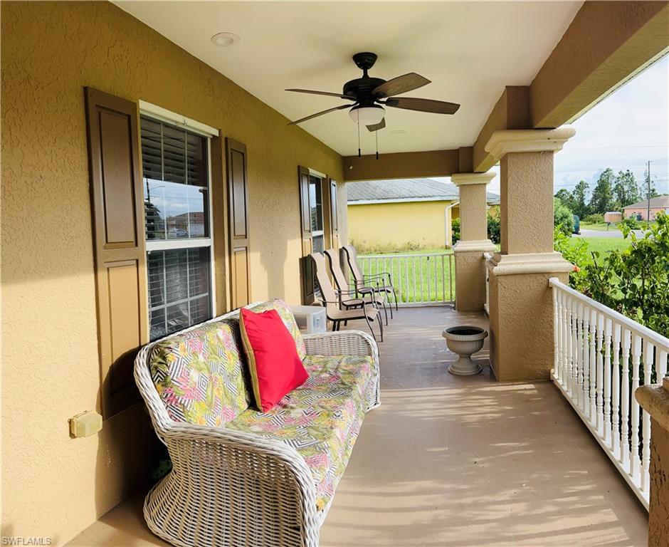 !!! Located in arguably the best location in Lehigh Acres, this 3/2/2 with a den has some nice bells and whistles and is ready to go! As you approach the front door, you will appreciate the large Southern style front porch area, perfect for rocking chairs and relaxing. Inside you will find cathedral ceilings, plant shelves, recessed lighting, upgraded with new flooring fan and lighting fixtures, !!! ROOF and  A/C IN 2018,!!! Water system (2021) hybrid hot water heater, newer super quiet garage door opener, not much left for you to cover! The rear screened lanai overlooks a spacious yard that is surrounded by a 6 foot chain link fence and circling the home are palm trees and nice landscaping. The home is wired for a home security system already and you are protected during hurricane season with a full set of metal shutters in the garage. Both will decrease your insurance rate as well! Located literally minutes from The Forum, I-75, Buckingham dog park, Restaurants, and more.