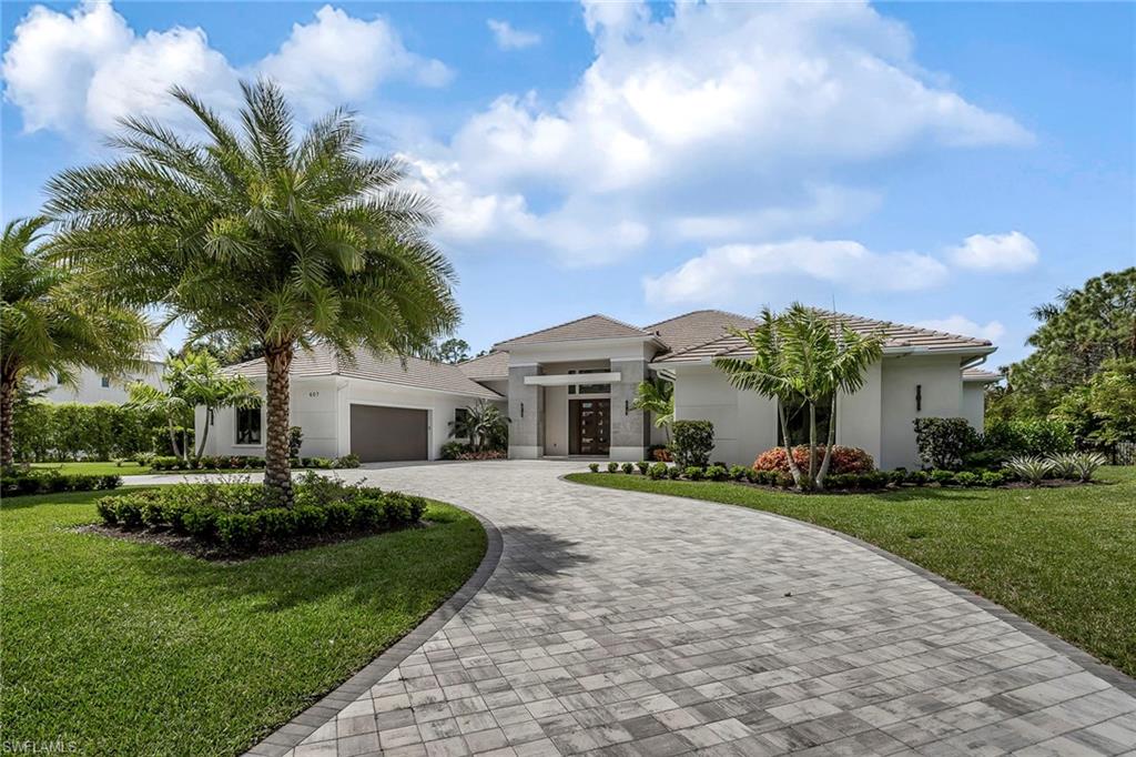 Built in 2021 and move-in ready opportunity now in highly coveted Pine Ridge. Single-story spacious floor plan with four en-suite bedrooms, walk-in closets, study, den, chef’s kitchen with oversized walk-in pantry, powder bath, pool bath and double two-car garages. The glass-encased wine room in the foyer and the expansive outdoor covered living area welcome entertaining, complete with an outdoor kitchen/bar and pool/spa with fire features. Stock Custom Homes collaborated with Richard Guzman, of R.G. Designs Inc. to create this “transitional modern” home encompassing 8,061 square feet under a roof of luxurious, functional living with southwestern exposure. Furnished by Wilfredo Emanuel utilizing his distinct design to pull out all of the architectural elements. Blue hues and clean lines create a relaxed coastal elegance. Additional upgrades include an HVAC IQair system, new whole-house reverse osmosis, invisible dog fence, closets plus garage organizers and storage, window treatments, Sonos system. Located just minutes to world-class shopping, dining and Naples' white-sand beaches.