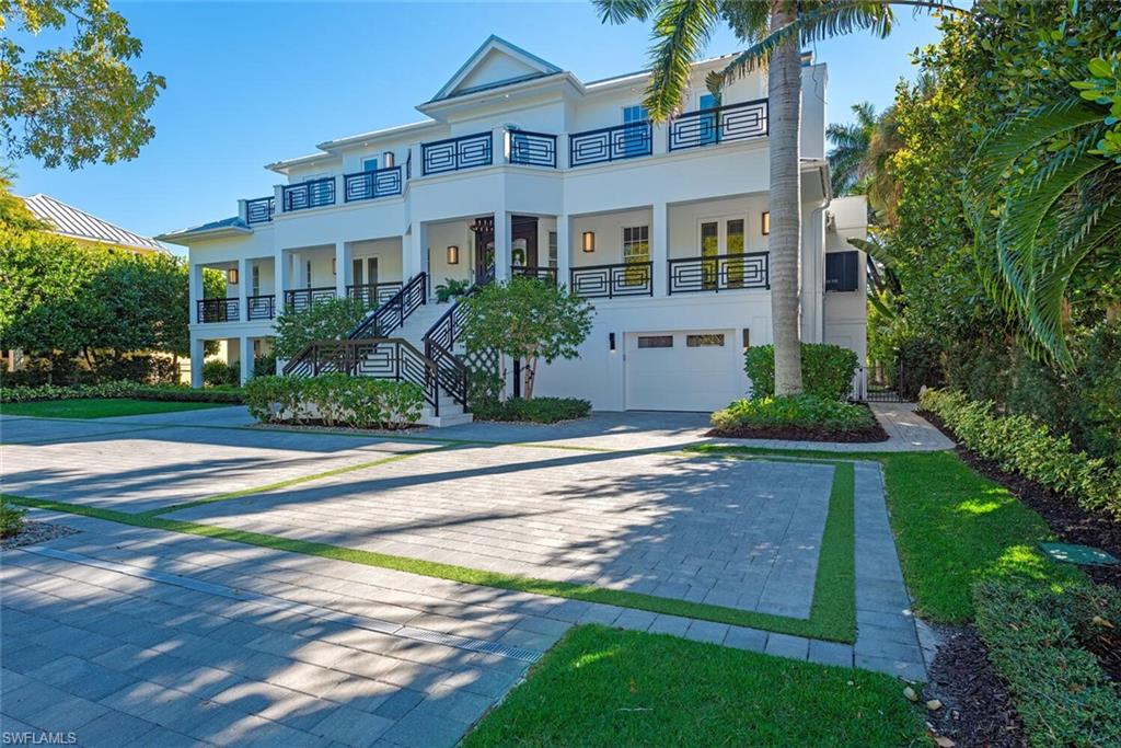 A landmark, custom built, Old Naples estate just four homes from the Gulf. Elevated and recently renovated, this exceptional residence offers over 7,500 square feet of refined AC-living with timeless architecture and exquisite craftsmanship. Features include a grand two-story foyer, coffered ceilings, rich millwork, library, formal dining, and expansive living spaces filled with natural light. The chef’s kitchen boasts Wolf and Sub-Zero appliances, dual islands, marble prep areas, butler’s pantry, and wine cellar. The luxurious master suite offers a sitting area, dual walk-in closets, spa bath, and private balcony. Outdoor living includes a heated, salt system pool and spa, outdoor kitchen, fireplace, lush landscaping, and shaded entertaining areas. Rare, air-conditioned garage for 10+ vehicles, impact windows and doors, private elevator, and generator. High and dry, moments to beaches, dining, and shopping—this is Old Naples luxury at its finest.