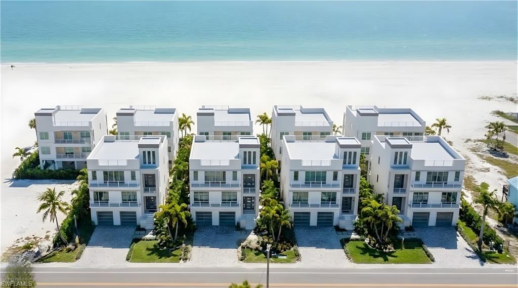 One or more photo(s) has been virtually staged, AI generated or rendered.  5256 Estero Boulevard presents a rare and captivating Gulf-to-Boulevard assemblage on Fort Myers Beach. Spanning over ½ acre with 90 feet of direct Gulf frontage and approximately 270 feet of depth, this exceptional offering provides an unmatched opportunity for investors, developers, or those seeking to create a legacy beachfront estate. (See the adjoining 5300 Estero assemblage for additional Gulf-front opportunities.)

The property consists of three parcels, including two Gulf-front single-family residences offering a combined 8 bedrooms, 6.5 bathrooms, and more than 4,500 square feet of living space, along with a large multifamily parcel extending to Estero Boulevard. This rear parcel can also be divided into two single-family homesites, creating an irreplaceable development footprint in one of Southwest Florida's most desirable beachfront locations.

Zoned for weekly rentals and new elevated construction with private pools, the property offers exceptional flexibility for luxury vacation homes, a boutique beachfront resort, an exclusive residential compound, or a high-performing income-producing investment. The weekly rental zoning significantly enhances the property's revenue potential while maximizing future development opportunities.

For those seeking an even larger vision, 5256 Estero Boulevard can be combined with the adjacent 5300 Estero assemblage, creating nearly one acre with approximately 180 feet of continuous Gulf frontage—one of the largest and most prestigious contiguous beachfront holdings on Fort Myers Beach.

With extremely limited Gulf-front inventory and the island's continued redevelopment, this is a once-in-a-generation opportunity to secure a premier beachfront investment offering exceptional scale, outstanding income potential, long-term value, and lasting legacy appeal in the heart of Fort Myers Beach.