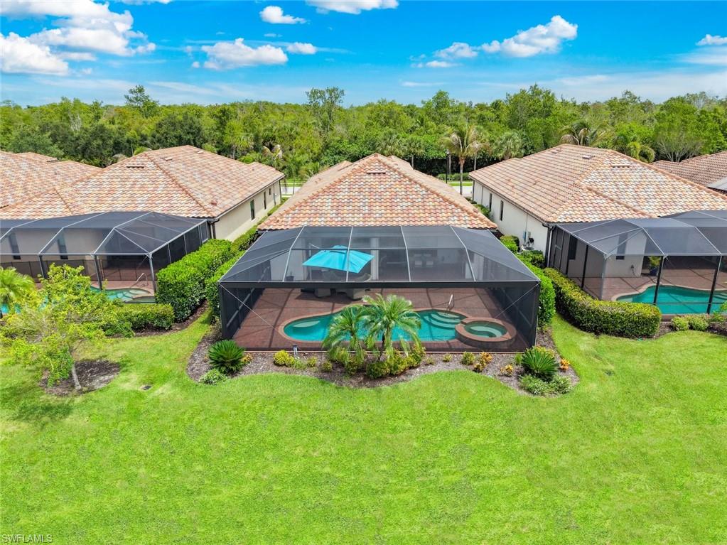 IMMEDIATE GOLF MEMBERSHIP AVAILABLE AND PRICED TO SELL! Experience the best of Naples golf and country club living in this impeccably maintained, partially furnished residence nestled within the prestigious TwinEagles Golf & Country Club. Perfectly positioned on a quiet street with a preserve to the north, this home enjoys coveted SOUTHERN EXPOSURE and beautiful water and golf course views, creating a private and picturesque setting for year-round enjoyment.

Designed for effortless indoor-outdoor living, the extended screened lanai features a sparkling POOL AND SPA, a new panoramic picture-screen enclosure, OUTDOOR GRILL, generous covered seating areas, and an additional pool bath—perfect for entertaining or simply relaxing while taking in the tranquil surroundings. Electric storm shutters, IMPACT WINDOWS AND DOORS, and freshly painted interior and exterior finishes provide peace of mind and move-in-ready convenience.

This desirable split-bedroom floor plan offers two spacious bedrooms plus a den and two full baths. The versatile den features a built-in Murphy bed, providing flexible space for overnight guests or a home office. At the heart of the home, the open-concept design showcases soaring tray ceilings and seamlessly connects the kitchen, dining area, great room, and outdoor living spaces, creating an inviting flow ideal for both everyday living and entertaining. The kitchen is both stylish and functional, featuring light-colored cabinetry, granite countertops, stainless steel appliances, a pantry, and ample workspace for gathering with family and friends.

Elegant finishes throughout include new luxury vinyl flooring in the bedrooms, plantation shutters, abundant natural light, and meticulous attention to detail. The spacious primary suite serves as a private retreat with dual vanities, a soaking tub, separate walk-in shower, and custom California Closets.

Additional highlights include epoxy garage flooring, extra storage shelving, and exceptional care throughout the home. Every detail has been thoughtfully considered to enhance comfort, functionality, and the Florida lifestyle.

Beyond the home, TwinEagles offers an unparalleled lifestyle centered around TWO CHAMPIONSHIP GOLF COURSES, a recently renovated clubhouse, resort-style pool and spa, fitness center, tennis, pickleball, bocce, dining venues, and an active social calendar. Surrounded by scenic preserves and natural beauty, TwinEagles remains one of Naples' most sought-after private golf communities.

This gated golf community also offers the convenience of owning your own golf cart (off-course use), allowing you to fully embrace the club lifestyle from day one. With IMMEDIATE GOLF MEMBERSHIP AVAILABLE, this exceptional property presents a rare opportunity to own a home that perfectly captures the luxury, beauty, and lifestyle that define TwinEagles.