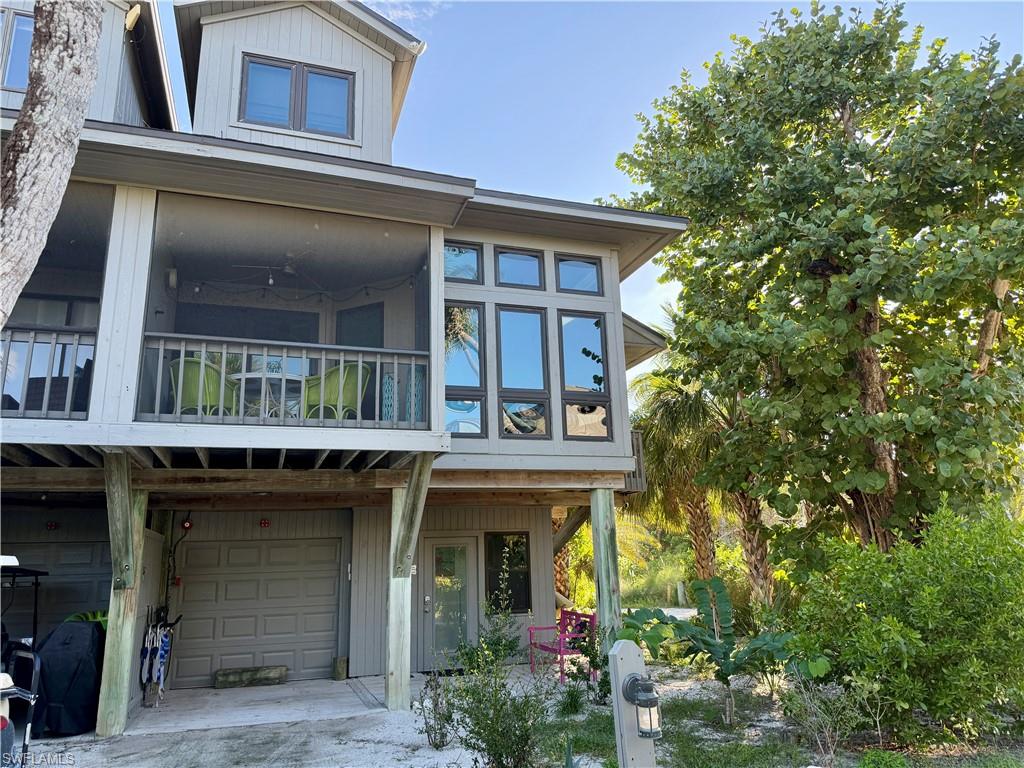 Experience the best of coastal living in one of the premier townhomes in Safety Harbor Club! This beautifully updated end-unit offers 3 bedrooms, 2 full baths, and is filled with natural light thanks to additional impact windows, creating a bright and airy interior throughout. Exceptional outdoor living awaits with two screened lanais plus a third balcony. Thoughtfully renovated, recent improvements include impact-resistant windows, a newer roof, newer HVAC system, and an on-demand tankless water heater, providing years of worry-free ownership. The finished lower level offers versatile space for a home office, fitness area, laundry room or guest accommodations, along with garage storage and a golf cart for added convenience. Offered fully furnished and turnkey, this move-in-ready residence is an outstanding full-time home, seasonal retreat, or income-producing investment with excellent rental history and opportunity for Seller Financing.  Safety Harbor Club residents enjoy resort-style amenities including a heated community pool, tennis and pickleball courts, clubhouse, convenient beach access, and dockage for boating enthusiasts. Enjoy the perfect combination of updated coastal elegance, abundant indoor-outdoor living, and an unbeatable waterfront lifestyle.