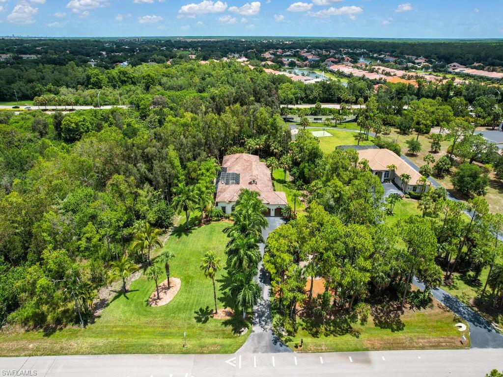 Pristine Logan Woods estate home! Enjoy the lifestyle of this beautiful courtyard pool home. As you enter through the front door into the private courtyard you are greeted by the pool and spa with extensive outdoor lanai space perfect for entertaining.  The 1 bedroom 1 bathroom cabana is also accessed from the courtyard, perfect for guests or additional living space.  Large sliders on the main living space allow for true indoor/outdoor living experience. The home features a 3 car garage, large master suite and open plan living space. All this on a gorgeous 2.5 acre lot just 5.5 miles to the beach and with easy access to I75, Physicians Regional Hospital, grocery stores and much more.