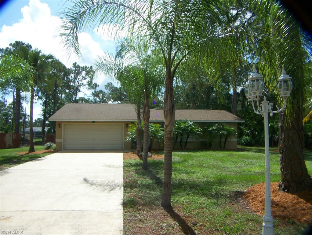 Affordable pool home on a fenced half acre lot-privacy fence surrounds the backyard, palm tree lined driveway, plenty of extra parking, below ground pool with marcite finish and new glass tile, new dimensional shingles on roof in 2014, ceramic tile floors, new carpet in master bedroom, marble counter tops in kitchen with new faucet, all kitchen appliances, walk in closet in master bedroom, French doors at entryway with decorative mosaic in tile, 3 ceiling fans, cathedral ceilings, covered patio, new pump motor and filter for in ground pool, decorative landscaped pond in the backyard, nicely landscaped half acre, traditional sale, fast local closings.