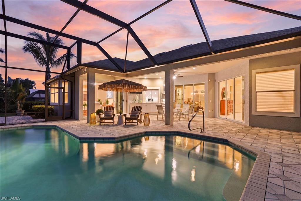 This is the North Naples lifestyle so many dream about. Set on an oversized lot with a quiet preserve backdrop and the 13th green of LaPlaya Golf Club just beyond, this custom-built home offers a rare combination of space, privacy, and a peaceful natural setting. Morning light filters through the trees, the greens stretch out beyond the Preserve view, and the atmosphere feels calm and tucked away. The added benefit of NO HOA provides flexibility and ease.
The updated kitchen features custom cabinetry, quartz surfaces, a walk-in pantry, and a built-in desk. The family room opens comfortably with a built-in lighted curio cabinetry and tile flooring, creating a relaxed, welcoming environment. The living room offers a quieter space with a serene view of the pool and preserve.
The oversized paver lanai becomes a true extension of the home. The outdoor kitchen includes a ceiling-mounted exhaust, built-in gas grill, and custom cabinetry. The pool, complete with water feature, sits privately against the preserve backdrop, creating a tranquil place to unwind or entertain.
The primary suite includes double tray ceilings with accent lighting, recessed lighting, and an ensuite with dual sinks and marble countertops.
All of this is minutes from Gulf beaches, shopping, dining, and A rated schools. Veterans Community Park is close by and offers tennis, lighted pickleball courts, bocce, racquetball, soccer, a multi-purpose hockey rink, playground, dog park, and picnic areas. The location blends convenience, privacy, and a relaxed coastal lifestyle in one of North Naples most desirable areas.
