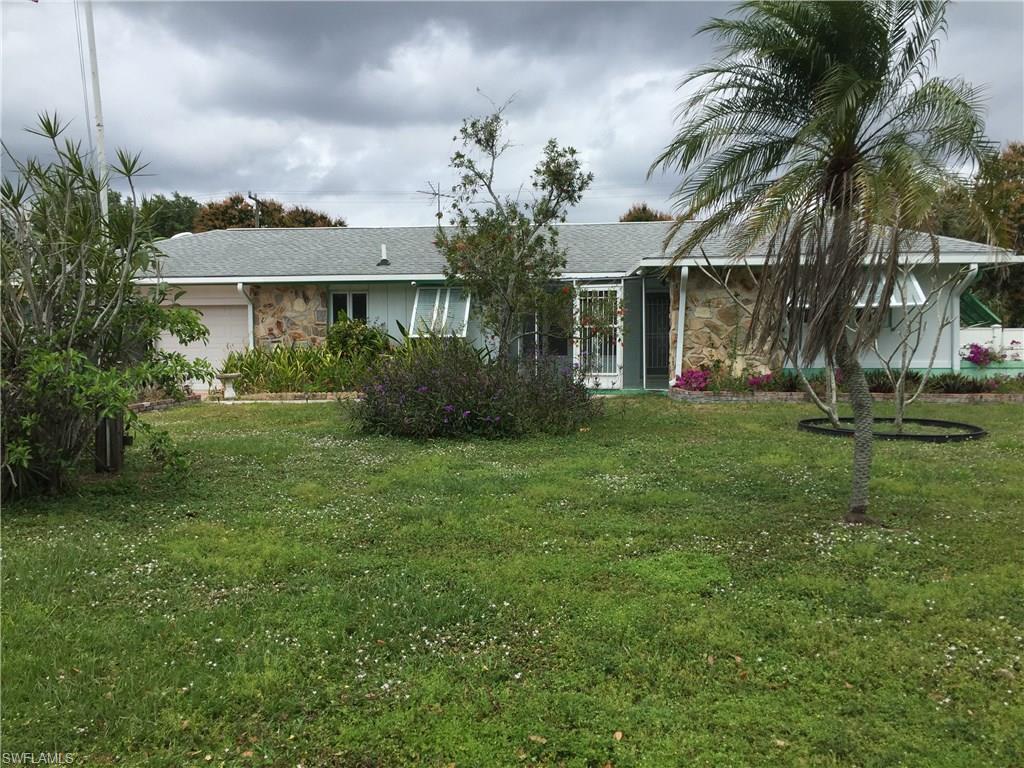 Lowest price home in much sought after Tanglewood. Large lot, beautiful pool and reinforced screen cage added in 2009. Roof was replaced in 2013 with a water barrier. Heavy duty gutters, new Anderson windows, central vac, and manual storm shutters, make this 2 bedroom, 2 bath home very desirable. Wood like flooring throughout. Bonus room could easily be third bedroom. Kitchen has custom cabinets with black appliances. Many fruit trees with partial fenced yard. Priced to sell at $224,900.
