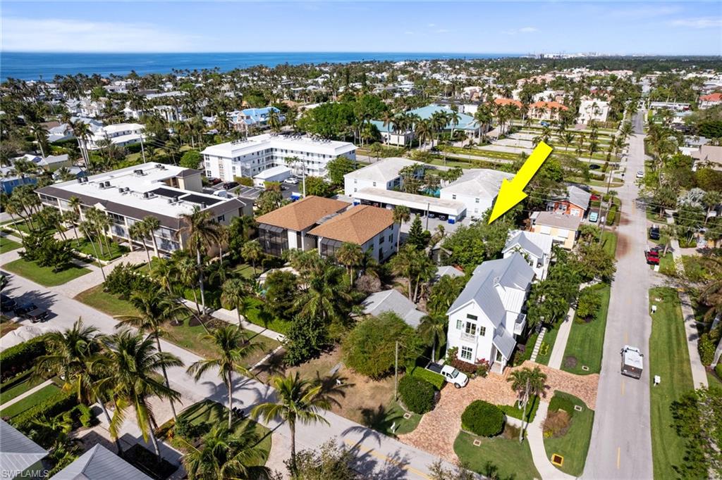 Rare Investment Opportunity in the Heart of Olde Naples. This .17-acre lot in prestigious downtown Olde Naples includes three existing structures—a main house and two guest cottages, each with its own paved driveways with rear alley access—providing the potential to restore the dwellings or build a new, expansive residence. Zoned R3-12, the property offers the unique potential to build two attached dwellings or a single, expansive residence. Whether you envision a single-story retreat, a grand two-story home, or want to restore the existing structures to their former charm, this lot offers endless possibilities for creating your ideal beach haven in one of Naples’ most sought after neighborhoods. Located just a few blocks from pristine Gulf of Mexico beaches, opportunities like this are becoming increasingly rare in downtown Naples. Situated in the highly coveted Naples Historic District, you’re just a short walk to 5th Ave South and 3rd Street South, where you can enjoy world-class dining, endless entertainment, charming boutiques, antique stores, and upscale shopping! With its unbeatable location, just two blocks from miles of stunning white sand beaches, you’re also minutes from iconic landmarks like the Naples Pier, Cambier Park, Tin City, the Naples City Dock, and vibrant cultural events including art shows, car shows, free concerts at Cambier Park, live entertainment, and holiday parades and events- including art shows, car shows, free concerts at Cambier Park, and seasonal parades on 5th Ave South. Picture starting your day with a morning swim at the beach, watching the glorious Naples Sunset from the beach everyday- that seems exclusive to Naples, or strolling to nearby cafés and shops, all just minutes from your front door. This is an ideal setting to create your dream coastal retreat. Surrounded by multi-million dollar homes, this rare lot offers a once-in-a-lifetime opportunity to create your ideal lifestyle in the heart of Olde Naples, where luxury, history, and charm seamlessly come together. Don’t miss your chance to own a piece of property in this highly sought-after location. Opportunities to build in this prime location are becoming increasingly harder to find. With its unparalled lifestyle, walkability, and proximity to some of the best beaches and amenities in the country, this property offers a coveted chance to experience the best of Naples living. With an average winter temperature in the low 70s, it’s the ideal destination for those seeking exclusivity and convenience in a beachfront setting. Experience the epitome of Naples living, where luxury knows no bounds and every day feels like a blissful getaway! This property offers endless potential and is an unparalleled investment opportunity! The 3 structures sustained about a foot of water damage and is being sold "as is" for lot value. Incredible location for an opportunity to re-build near the beach! Just a few short blocks to Naples Beach & the pier!