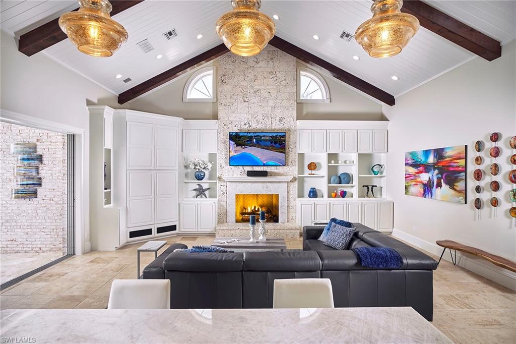 Perfectly situated on the quiet Cromwell Court, this newly renovated home offers a sprawling first level with southeasterly lake views from nearly every room. Pitched, tongue and groove ceilings frame the modernized kitchen with Cristallo quartzite countertops, gas Viking range and double islands, all seamlessly opening to the family room and covered lanai, perfect for entertaining. Residents will appreciate the expansive master suite with luxurious oak floors and a master bath and closet worth dreaming over. Conveniently located outside the master suite hallway is the study, nicely placed for a quiet sitting space or in-home office. Just a short distance to the Bay Colony Beach and club and inclusive of a new roof, 3-car garage, newer AC units and a freshly resurfaced pool, this home is a great opportunity for the idyllic Naples lifestyle.