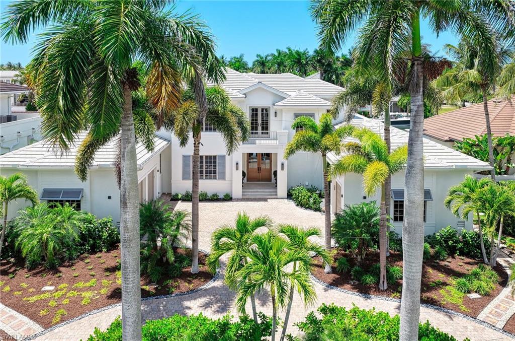 Experience the best of Naples waterfront living at 1888 6th St S, a stunning single-family home in Aqualane Shores that has been beautifully refreshed by Gulfshore Construction to live and function like a new home. Set on wide water along Heron Cove, this property delivers direct Gulf access with no bridges, making every day on the water simple and enjoyable. A new dock with boat and jet ski lifts, along with a newer seawall, create a true boater’s paradise right in your backyard.

Spanning over 5,500 square feet, this spacious residence offers plenty of flexibility and room for guests with 4 bedrooms, 5.5 updated bathrooms, formal living room, family room, den, study and loft. The first floor primary suite is a private retreat, featuring warm wide plank wood flooring, dual walk-in closets, and a spa style bathroom with a Victoria + Albert soaking tub, separate shower, and dual quartz vanities. Upstairs, each guest suite includes its own ensuite bath and balcony access, providing comfort and privacy throughout.

The heart of the home is the chef inspired kitchen, fully remodeled with large quartz island, custom cabinetry, and top-tier appliances including a gas Wolf range, Thermador refrigerator, Miele convection oven, Bosch microwave, and dual Asko dishwashers. The open flow into the family room, complete with built-ins, fireplace, and large picture windows, makes this space ideal for everyday living and entertaining. A formal living room with coffered ceiling details along with dining area with a wet bar and wine chiller adds elegance and flexibility.

The resort style outdoor living area is designed for year round enjoyment. A spacious covered lanai features motorized screens and a full summer kitchen with Sedona grill, sink, and under counter refrigerator. The newly installed negative-edge saltwater pool and spa (2025) are perfectly positioned to capture glowing western sunset views. 

Additional highlights include a new tile roof (2025), Lutron lighting system, propane gas service, and climate-controlled garages.

This Aqualane Shores waterfront home combines modern updates, premium finishes, and exceptional boating access in one of Naples’ most sought-after locations near Gulf beaches and Third Street South. Truly a must see!