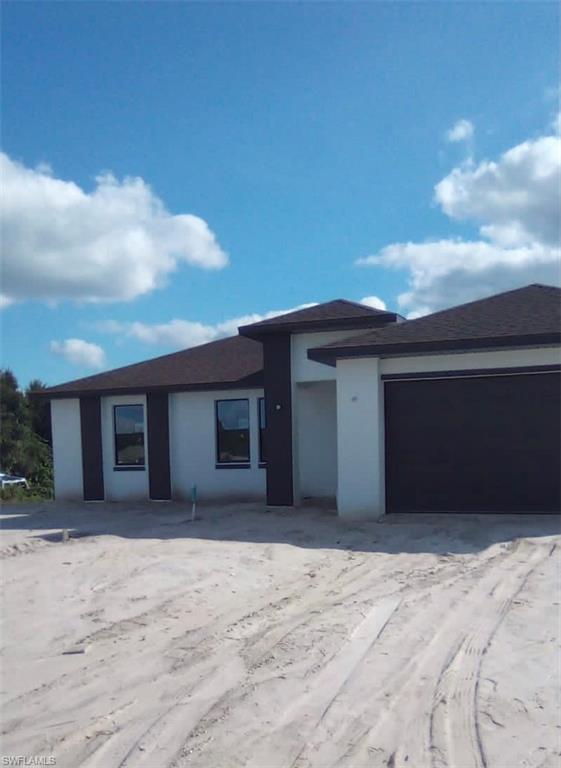 WELCOME!!!! To one of the best areas in Lehigh Acres, this wonderful new construction home has it all, 3 bed/2 baths, 2 car garage, tile all throughout, stainless steel appliances, granite counters, showers, beautiful landscaping, wonderful layout very spacious in a nice and quite area, no more lots available for sale in the exclusive area.