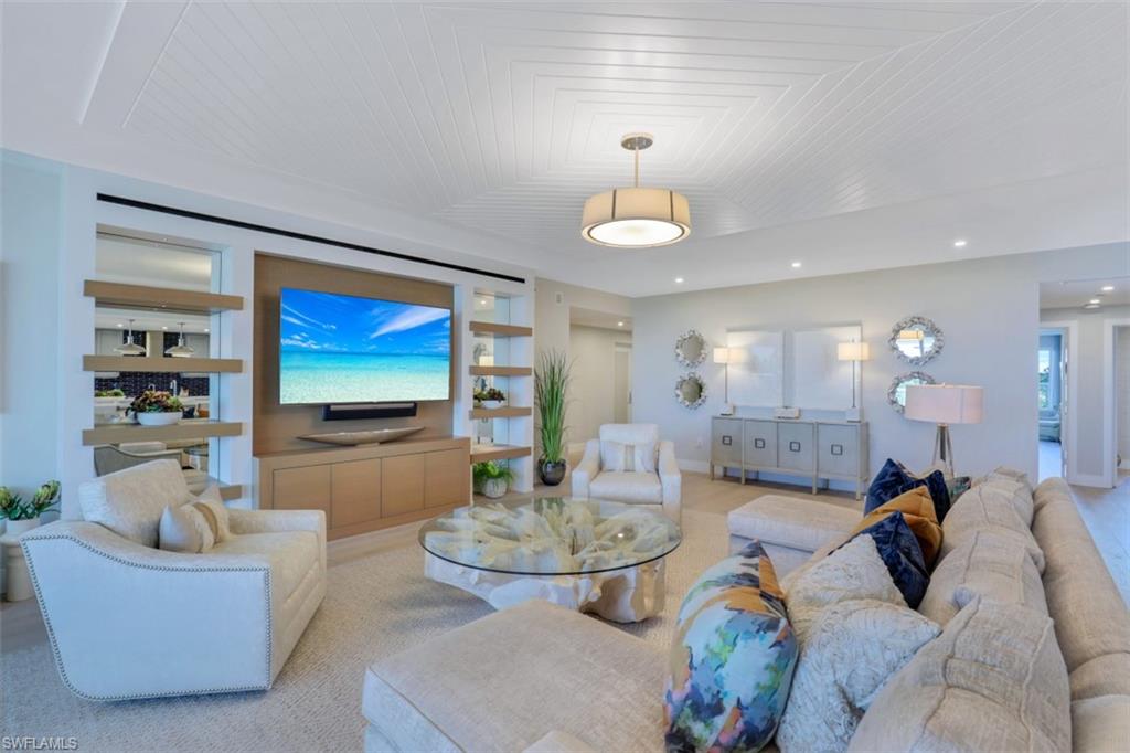 Highly sought after – This Kalea Bay terrace unit overlooks serene preserve views with over 1,200 sqft of outdoor living space outfitted with sleek glass railings.  Professionally decorated in a light coastal palette with high-end furnishings and finishes, the residence features an open layout with ample floor-to-ceiling windows inviting in natural light that evokes casual elegance and comfort.  Exquisite interior details include a chef’s kitchen with a waterfall island, Subzero appliances, natural gas, quartz countertops, light wood flooring, and a private entry elevator.  Kalea Bay is a waterfront community comprised of 5 luxury towers with amenities rivaling a 5-star resort.  For starters, building amenities include a rooftop pool and deck, sky lounge, and an open-air fitness area.  The community also has an 88,000 sqft clubhouse with 3 pools, including a resort-style pool, adults-only pool, children’s pool, two open-air bar, indoor/outdoor restaurant, snack bar, lakeside fire pit, and beach shuttle service.  The tennis pavilion has 4 Har-Tru tennis courts and 8 pickleball courts.  Kalea Bay also has guest cottages and optional beach and restaurant access at Moraya Bay.