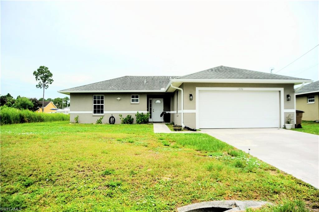 Welcome to this beautifully maintained 3-bedroom, 2-bath home in the heart of Lehigh Acres! Featuring an open-concept floor plan with 1,357 square feet of living space, this home offers high ceilings, abundant natural light, and a spacious two-car attached garage. Recent updates include new flooring, stainless steel refrigerator and stove, a 2018 roof, and a 2025 water heater, providing peace of mind for years to come. Situated on a desirable quarter-acre lot with no HOA, there’s plenty of room for outdoor entertaining, gardening, pets, or future additions. Located in a peaceful, family-oriented, and growing neighborhood, this home offers the perfect balance of tranquility and convenience with shopping, dining, schools, and major roadways just minutes away.