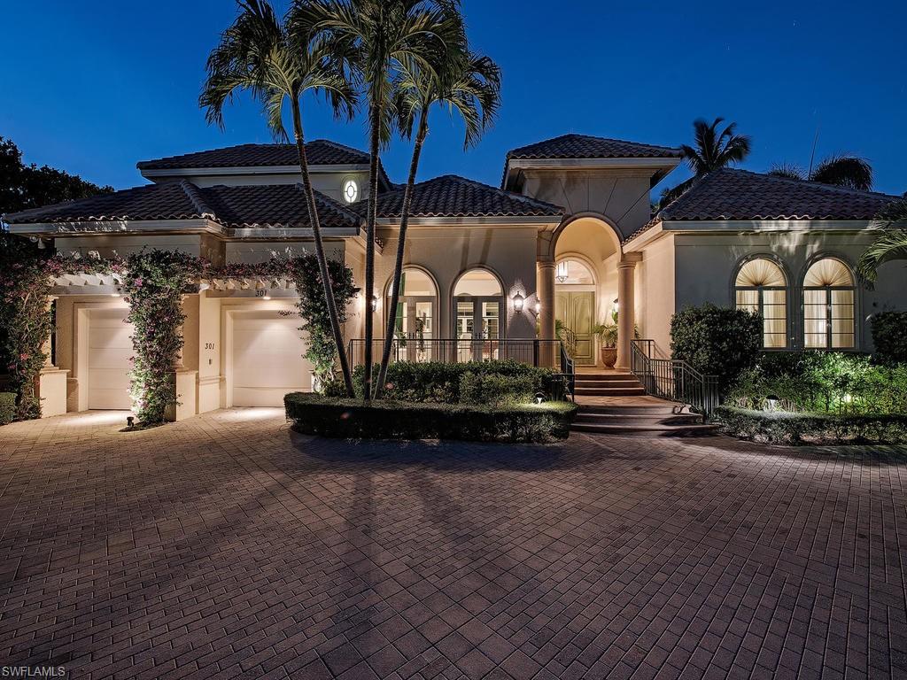 Charming, classic architecture combined with the privacy of a coveted quiet cul-de-sac location. This custom Kurtz built home offers large rooms, high ceilings with great natural light and comfortable outdoor living area with pool. The home overlooks a lovely lake with a tranquil water feature. First floor master suite and 2nd bedroom suite, bar area, dining, living and family rooms. The 2nd floor guest quarters offers 3 lovely bedroom suites, spacious living area, kitchen and additional laundry facilities. Little Harbour is a unique enclave of luxury homes, and the only gated community with Associate Port Royal Club membership opportunity. With community boat slips, beach access across the street, and a short stroll or bike ride to Third Street South dining and shopping, this home is in a truly special setting.