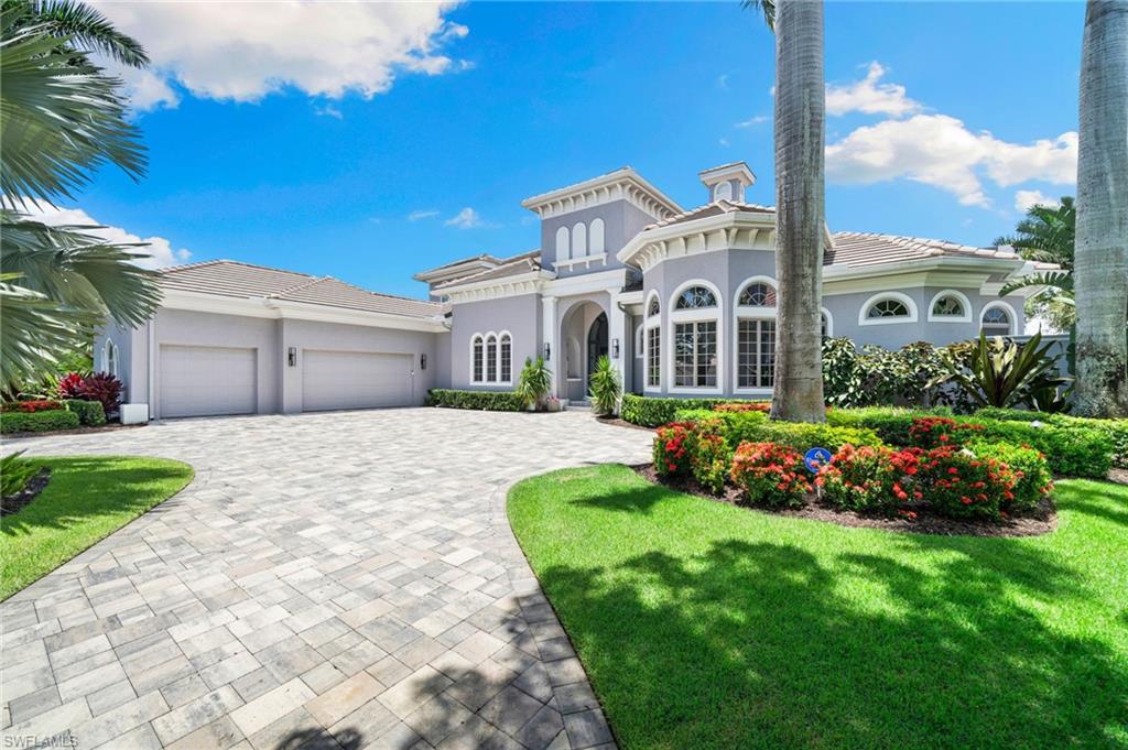 Welcome to this magnificent custom estate in Shadow Wood at The Brooks, where timeless design meets modern luxury. Spanning two floors of elevated living, this home has been meticulously updated inside and out over the past three years, offering the perfect blend of sophistication, comfort, and functionality.

Set on a premier golf course lot with tranquil lake views, this residence features over 5,300 sq ft of air-conditioned living space and an exceptional outdoor lifestyle—complete with three verandas, a cozy fireplace, summer kitchen, and a resort-style pool and spa. All exterior elements have been refreshed or replaced, including the roof, driveway, front porch, pool equipment, screen enclosure, outdoor tile, landscape lighting, and irrigation. The outdoor living areas are fully integrated with smart features, including app-controlled pool systems, exterior security cameras, and smart garage openers.

Inside, the home is just as impressive. The oversized kitchen has been updated with refinished cabinetry, new custom doors, and commercial-grade Sub-Zero and Wolf appliances, along with a large center island ideal for gathering. A stylish wet bar opens to the formal living room, while the adjacent dining room offers elegant space for entertaining. The family room’s 90-degree zero-edge sliders disappear to reveal seamless access to the outdoor living area, creating a true indoor-outdoor experience.

The first floor also includes a spacious study, powder bath, guest suite with private pool bath, and a generous laundry room. The primary suite is a retreat of its own, complete with a morning room and coffee bar, his-and-hers walk-in closets, and a spa-inspired bath with walk-through shower and jetted Roman tub. Upstairs, a billiards room with full bar overlooks the living space below, and two additional guest suites—each with private baths and balcony access—offer comfort and privacy for visitors.

Throughout the home, you'll find all-new tile flooring (no overlays), fully renovated bathrooms, Emtek hardware, updated lighting, power shades, Lutron lighting controls, beverage coolers, and ice makers—all lightly used and beautifully maintained. Furnishings are included, with everything less than three years old.

This is luxury living redefined—where every detail has been considered, and every finish speaks to quality.