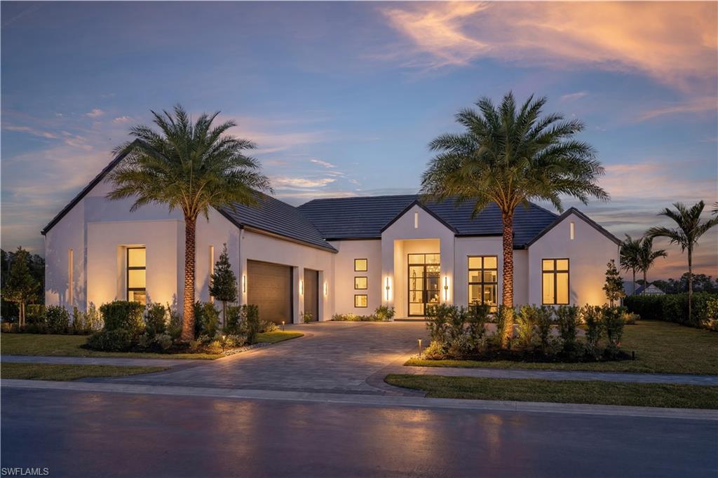 Designer furnished and move-in ready! Seagate Development Group and Theory Design proudly present the professionally designed Meadowbrook model home in Opus Stone, one of Naples’ newest luxury gated communities. This exceptional residence is the result of a collaboration between Seagate Development Group, Theory Design, RG Designs, and Outside Productions, bringing together some of Southwest Florida’s most respected design professionals. The Meadowbrook offers three bedrooms, a private study, three full baths, two half baths, and a spacious three-car garage within a thoughtfully designed open floor plan that blends modern architecture with timeless coastal elegance. Inspired by refined Hamptons-style interiors, the home features clean architectural lines, natural textures, and a light neutral palette that creates a sophisticated yet inviting living environment. The great room and kitchen seamlessly connect to the outdoor living space, creating a perfect setting for entertaining or everyday living. The designer kitchen showcases a beautiful blend of white oak and latte wood cabinetry paired with wide plank oak flooring, shaker-style doors, and refined millwork including 9.5-inch baseboards with minimal profile door and window casings. Large gallery art walls allow for striking displays of artwork while accents of aged brass and matte black add a polished modern touch throughout the home. Wood-accented ceilings in the kitchen and dining areas introduce warmth and texture while enhancing the home’s elevated design. The expansive outdoor living area captures the essence of the Naples lifestyle with an oversized resort-style pool featuring a bubbler and spa, a fire pit gathering area, outdoor kitchen, fireplace, pool bath, and lush professionally designed landscaping that creates a private outdoor retreat. A tongue and groove stained ceiling enhances the covered lanai, providing an elegant architectural element that ties the outdoor living space together. Additional luxury features include 1¾-inch solid core interior doors, Emtek door hardware, custom built-in closets, Andersen impact windows and doors, Control4 home automation system, integrated sound system, linear HVAC diffusers in common areas, level 5 drywall finish, spray foam insulation, natural gas, and interior designer selected furnishings throughout the home. Opus Stone offers a rare opportunity to enjoy luxury estate living in an intimate gated setting while being just minutes from the best that Naples has to offer. Residents enjoy convenient access to world-renowned Gulf beaches, upscale shopping, fine dining, and entertainment. Premier private golf clubs including Olde Florida Golf Club and Calusa Pines Golf Club are also nearby, offering exceptional opportunities for recreation and social life. Experience the craftsmanship, design excellence, and lifestyle that define Seagate Development Group homes in one of Naples’ most exciting new gated luxury communities.