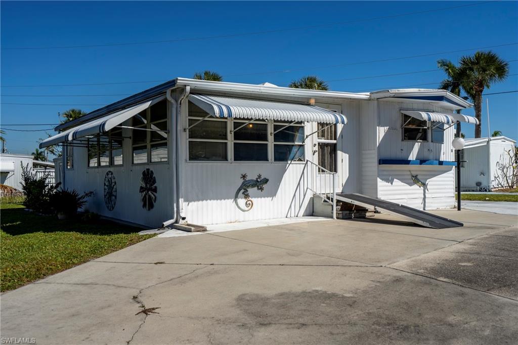 This property is located in a 55+ community that offers many great amenities. This 2-bedroom, 2-full bathroom home is ready for its future owner and includes a spacious living room, eat-in kitchen, enclosed porch, bonus room, and lots of windows with natural light. Updates to the home include remodeled bathrooms and newer flooring in the living room, kitchen, and bedrooms. The front entrance also has a wheelchair-accessible ramp, which can be removed if not needed. The community has a low monthly HOA of only $174 and includes access to a heated swimming pool, 9-hole golf course, clubhouse, shuffleboard, bocce ball, free boat storage and docking, and a private boat launch with access to the Caloosahatchee River and the Gulf. There are many ways to enjoy Florida living in this community. All offers are welcome!