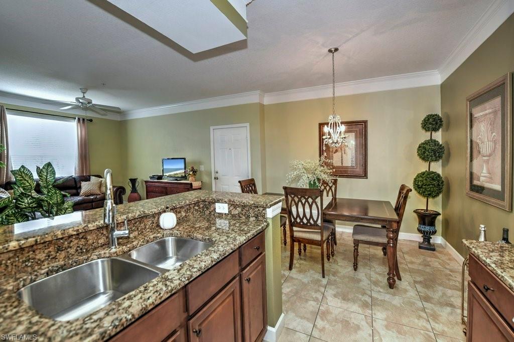 Hard to come by first floor unit in Royal Greens! Nothing to do but move in!  Unit is being sold turnkey furnished and recently went through a beautiful makeover including new ac, water heater, granite counters, upgraded wood cabinetry and neutral tile flooring throughout.  Unit has a spacious master bedroom in addition to a den of the same size that can be used as a second bedroom or office.  Royal Greens is a gated community in Gateway of Fort Myers that has walking/biking trails to coffee shops, restaurants and bars.  Gateway Country Club offers optional affordable memberships for country club memberships for tennis, golf, fitness and social memberships.  Minutes to RSW International Airport, Highway 75 with easy access to shopping at Miromar Outlets, Gulfcoast Town Center and FGCU College.