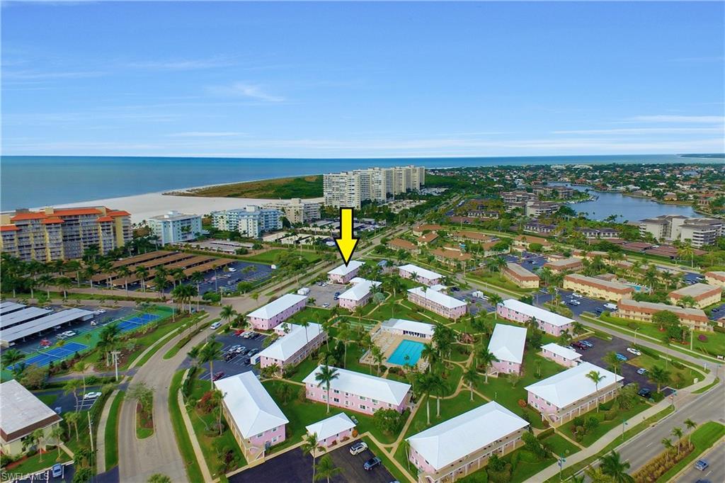 Classic Marco Island Seabreeze South one bedroom one bathroom condo is ready for you to move right in! No damage from Hurricane Ian. Second floor unit has hurricane impact windows. Excellent location on the west (Seaview Court) side of complex away from the traffic on Collier Blvd, while still close to restaurants, Residents' beach and all that Marco Island has to offer. Bedroom overlooks the tranquil, tropical park-like landscaped area. Steps from the large sparkling heated pool and shuffleboard court. This is one of the rare condos on Marco that allows owners to have small pets! Ample laundry facilities and extra storage in separate buildings adjacent to parking lot. This has been a favorite Marco Island condo complex for over 50 years! One assigned parking space and guest parking. 30 day minimum lease 12 times per year permitted. Own your piece of Marco Island today.