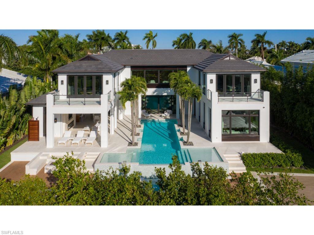 New and never lived in! The owners have spent the past year thoughtfully and meticulously enhancing this exceptional home and property. Creatively designed by Kukk Architecture & Design, P.A. and constructed by A. Vernon Allen Builder, Inc., the property represents the pinnacle of modern day conveniences and luxuries. Recent improvements are too numerous to list. The large kitchen and spacious great room open seamlessly beyond the large “lift and slide” doors to abundant outdoor space, offering both covered and uncovered areas for social gatherings. When seeking respite, residents and guests will enjoy the 6 private bedrooms (one currently being used as an exercise room with sauna) and an office. Highly desirable southern exposure. 4 car garage. Located in close proximity to the excitement of Third Street South. Quick access to Naples Bay and the estuarine waterways by boat.