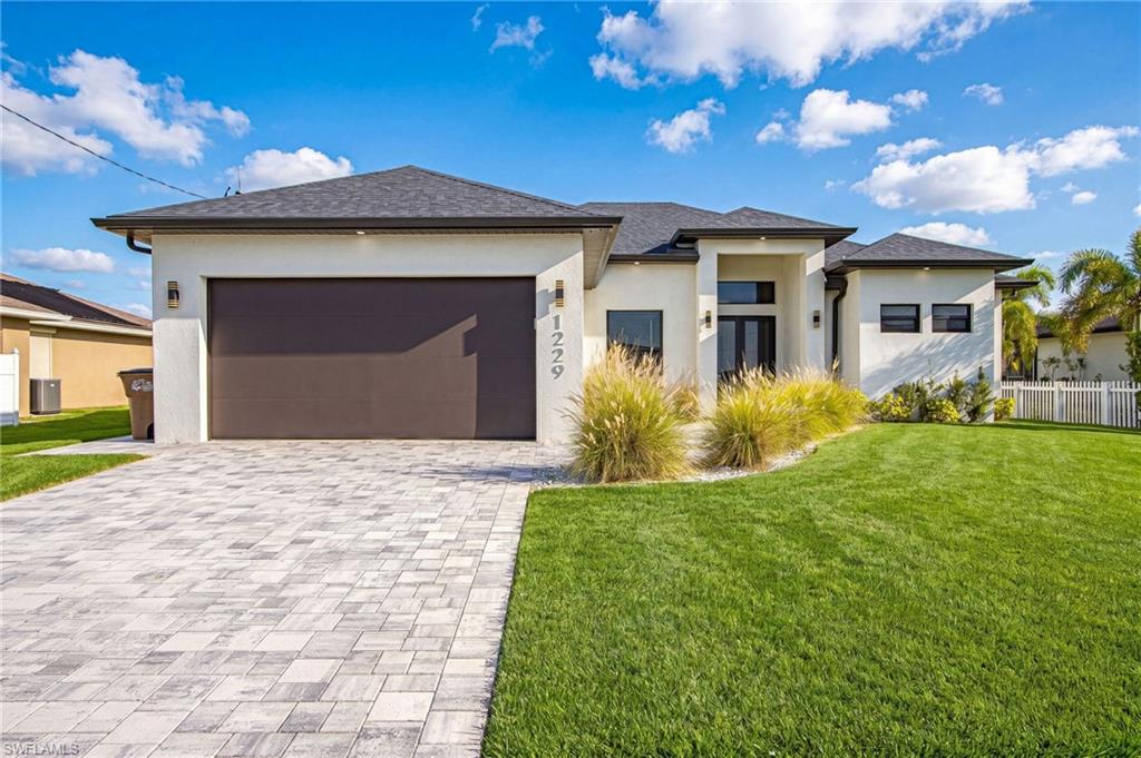 GORGEOUS and better than new! This immaculate 3-bedroom, 3-bath home was built in 2023 and showcases quality finishes throughout, including stunning cultured marble flooring. The open and inviting floor plan is perfect for both everyday living and entertaining. Step outside to your private tropical retreat featuring a beautiful pool and spacious deck area, ideal for enjoying the Florida lifestyle year-round. Located in one of Cape Coral's most desirable and rapidly growing areas, just minutes from Burnt Store Road and the exciting Seven Islands development, offering future dining, shopping, recreation, and waterfront attractions. This move-in ready home combines modern construction, luxury finishes, and an exceptional location. Don't miss this incredible opportunity!