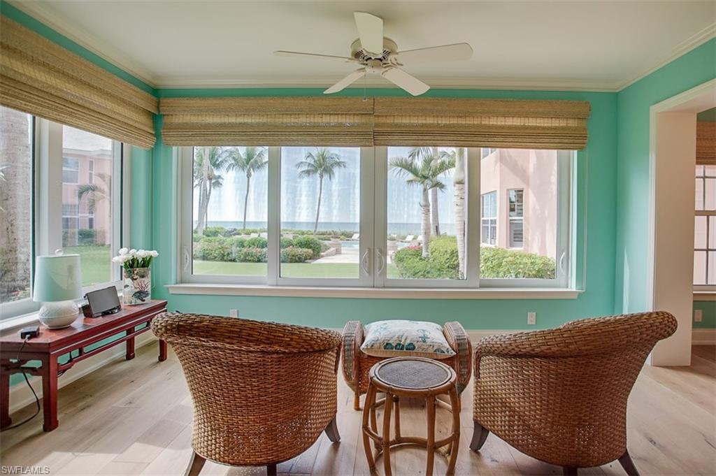 Rarely available! Shores of Naples offers Gulf front living at it's best. With all the benefits of a condo but the living style of a home this villa is one of a kind.  Fully remodeled the unit features 2 bedrooms and 2 bathrooms, bedrooms have access to a private deck, wood floors throughout and an amazing kitchen space perfect for entertaining.  Step out the back door of this unit and the pool and beach are only a few steps away.  The undercover parking space just steps from your front door boasts a great size extra storage. As an added benefit impact windows and doors were installed. Don't miss this opportunity.