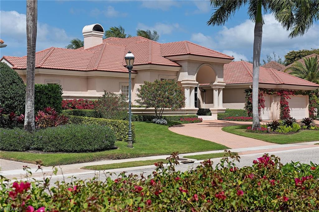 This lovely lakefront home is nestled on a quiet cul-de-sac location in the prestigious Bay Colony Shores. Providing all the comforts of home, this beautifully maintained, single-story residence awaits your finishing touches! Featuring over 4,100 square feet of living, 5 bedrooms (or 4 plus an office), 5 full baths, 16' volume ceilings, polished marble floors in all common spaces, a wood-burning fireplace with gorgeous coral stone surrounds, stainless steel appliances and a 3-car garage with circle driveway. The interior flows effortlessly to the outdoor lanai featuring a recently updated pool and spa and all new travertine decking.