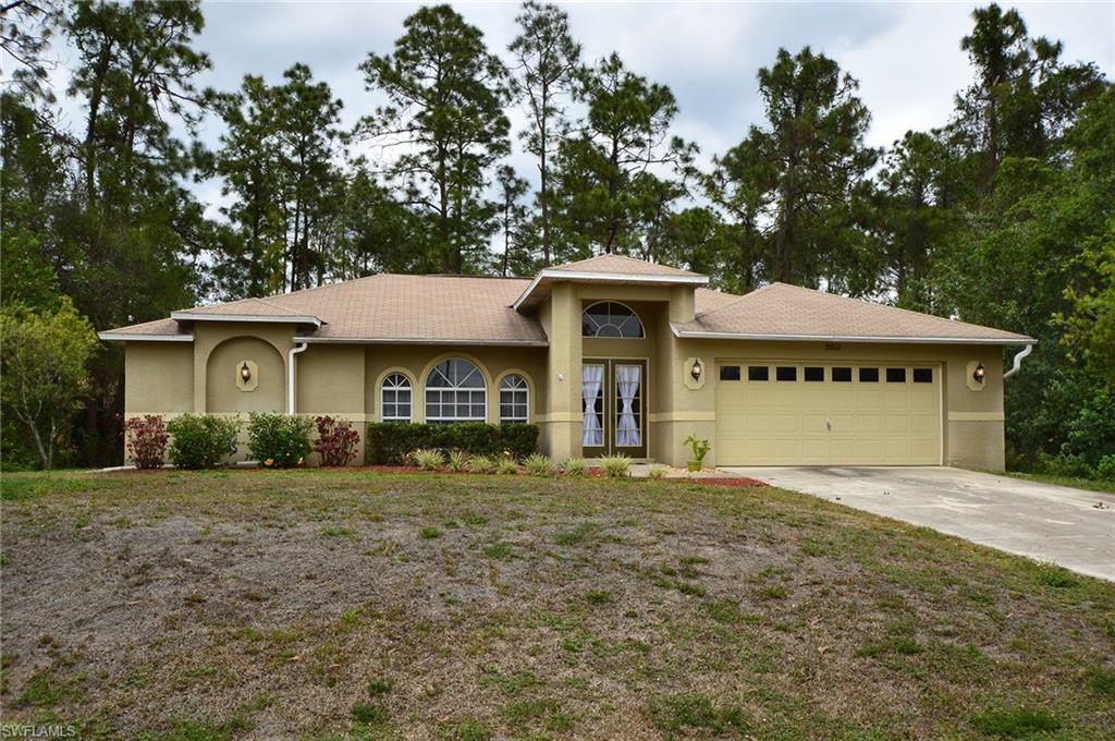 H.11883 - Enter the french doors of this home and be greeted with gorgeous laminate wood floors, an open and airy great room,tranquil views of the rear privacy landscaping and a warm and inviting atmosphere!  This home is located near the Buckingham Community Park providing easy access to a local dog park, dining, shopping, Interstate 75 and the Ft Myers area, including all of the events hosted at the River District! Kitchen opens to living area with a lovely breakfast bar, decorative wall back splash and center island.  All of the appliances are included-even the washer & dryer!  This home features plant shelves in the living and dining areas, a security system, lots of natural light, a newer 14 Seer 3-ton AC, split bedrooms and is perfect for a family or a second home.  More Photos to Come!