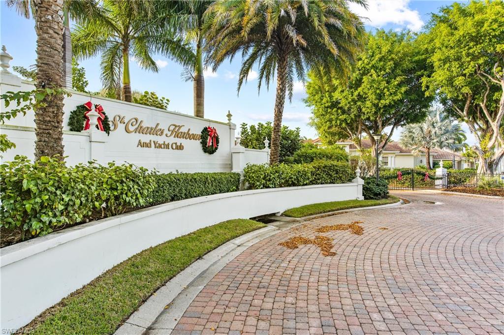 This is one of the most incredible waterfront properties in all of SWFL. Located in exclusive-gated St Charles Harbour, this Huge double lot offers 300 ft of prime water frontage with its own private protected boat basin, 2 boat lifts & room to moor your large yacht. St Charles Harbour features a private clubhouse with casual/fine dining, community pool & tennis, a deep water harbor & marina for large yachts offering direct intercoastal access minutes to the open Gulf & Bay waters. The property offers a beautiful one-level 5100 sq ft home with 4 large bedrooms, awesome master retreat & den area, beautiful kitchen area with 2 large islands, spacious living/family & dining rooms, great bar area, 4 car garage & more. The home has been totally updated & offers 12' ft high ceilings, 9' ft solid core doors, beautiful flooring, huge pocket sliders off both main living areas, large pool lanai areas, HUGE lush tropical landscaped back yard with brick paver walking paths. This is an Incredible Property!